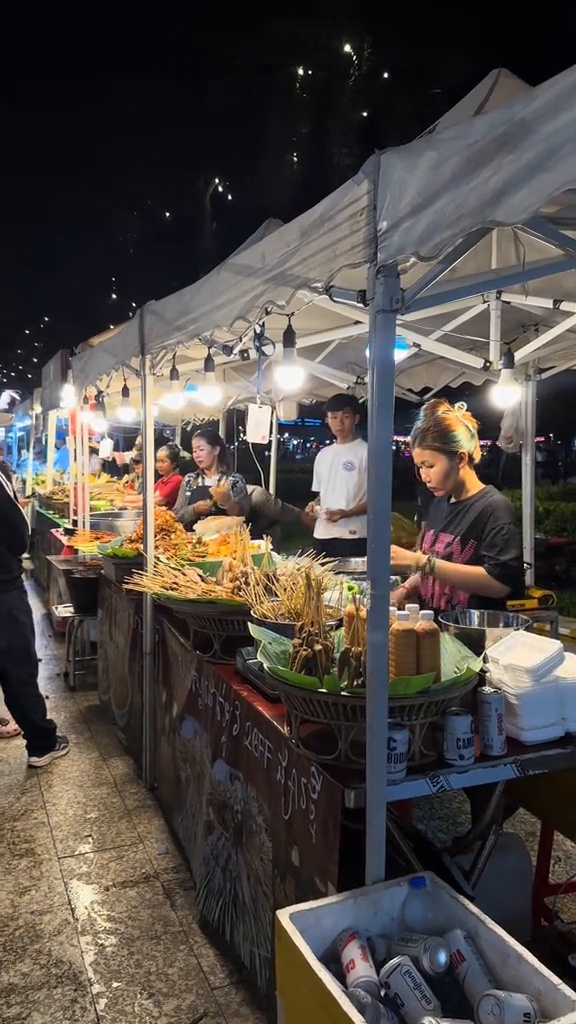 Shoppers browsing market goods